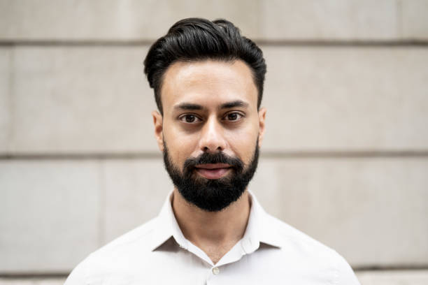 Portrait of Sohail Malik, a happy auto loan customer in business casual attire